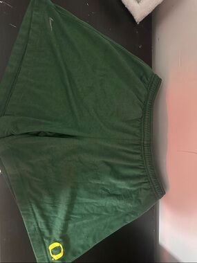 Green Athletic Shorts with Small Swoosh Logo